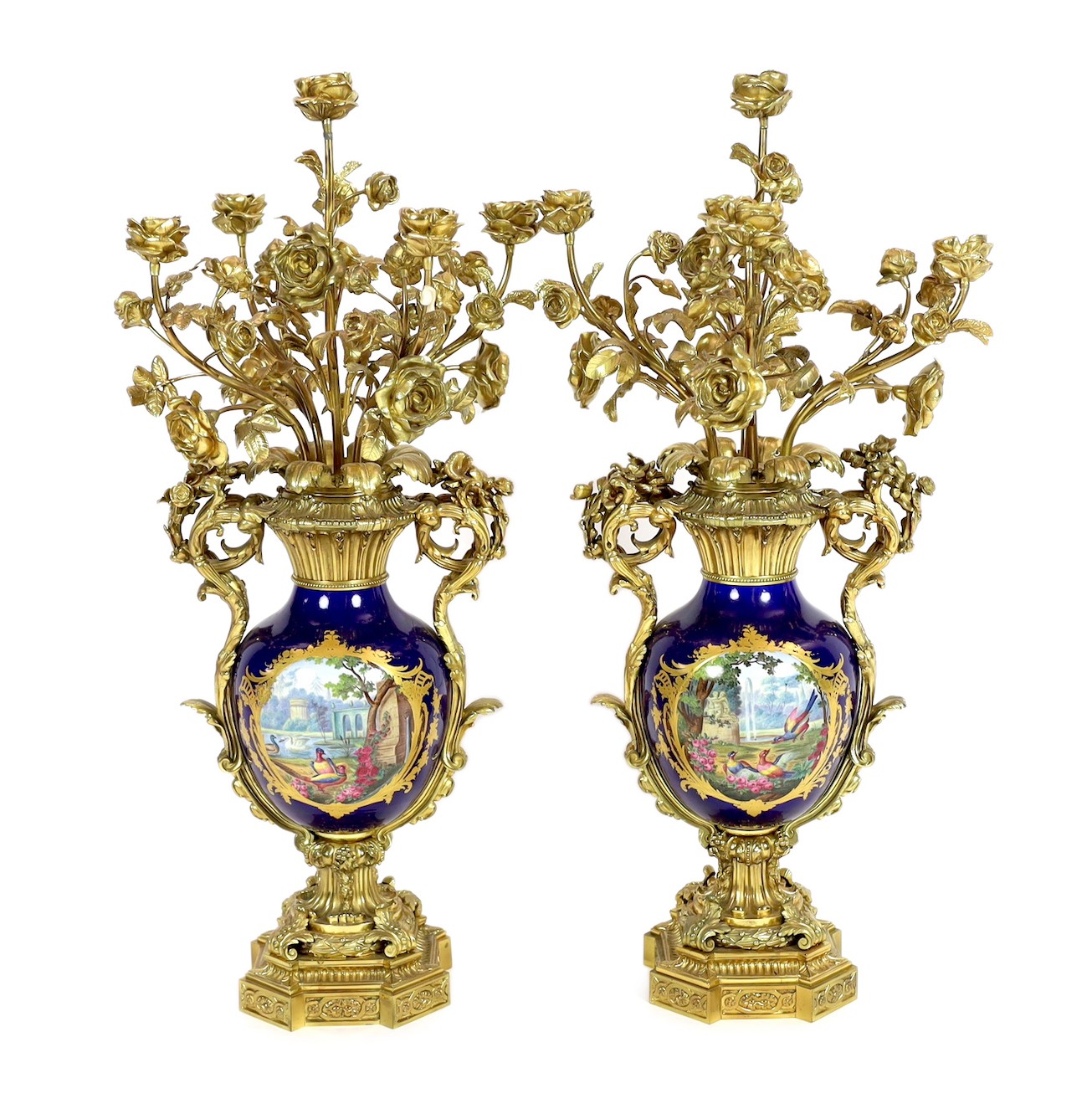 A pair of large French Sevres style ormolu mounted candelabra, in Louis XVI style, 19th century, 69cm high